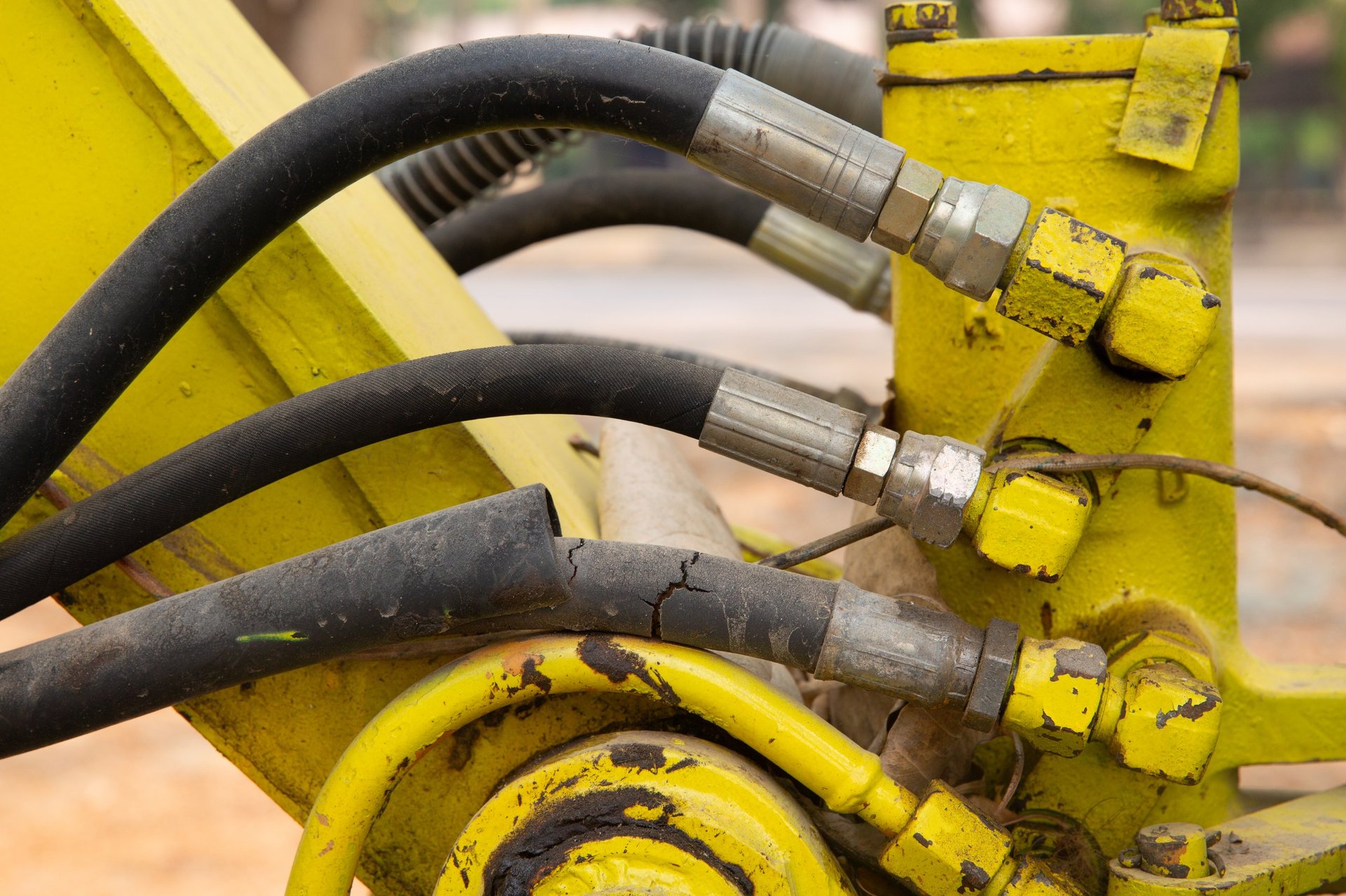 Broken hydraulic hose on excavator