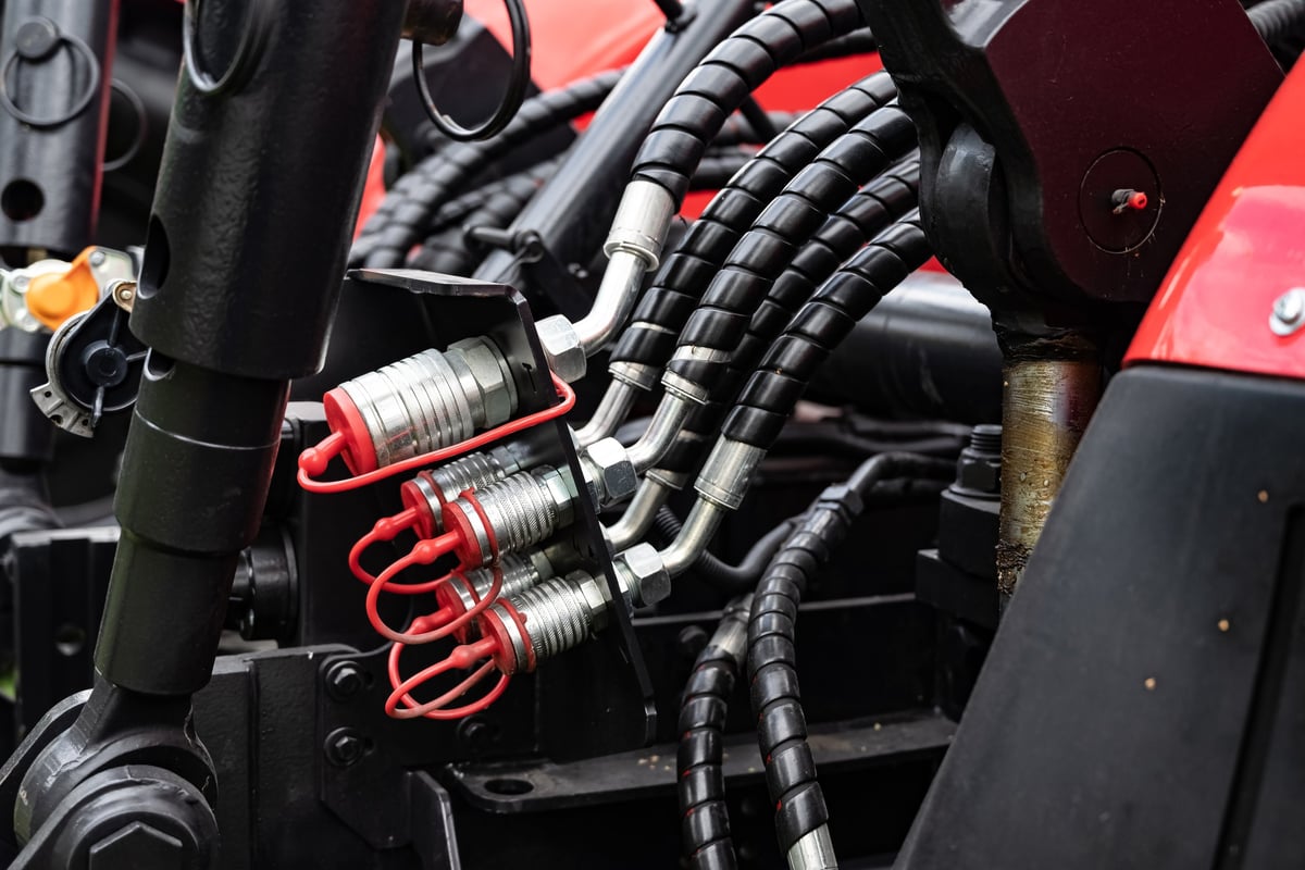 Detailed view of hydraulic hoses and connectors